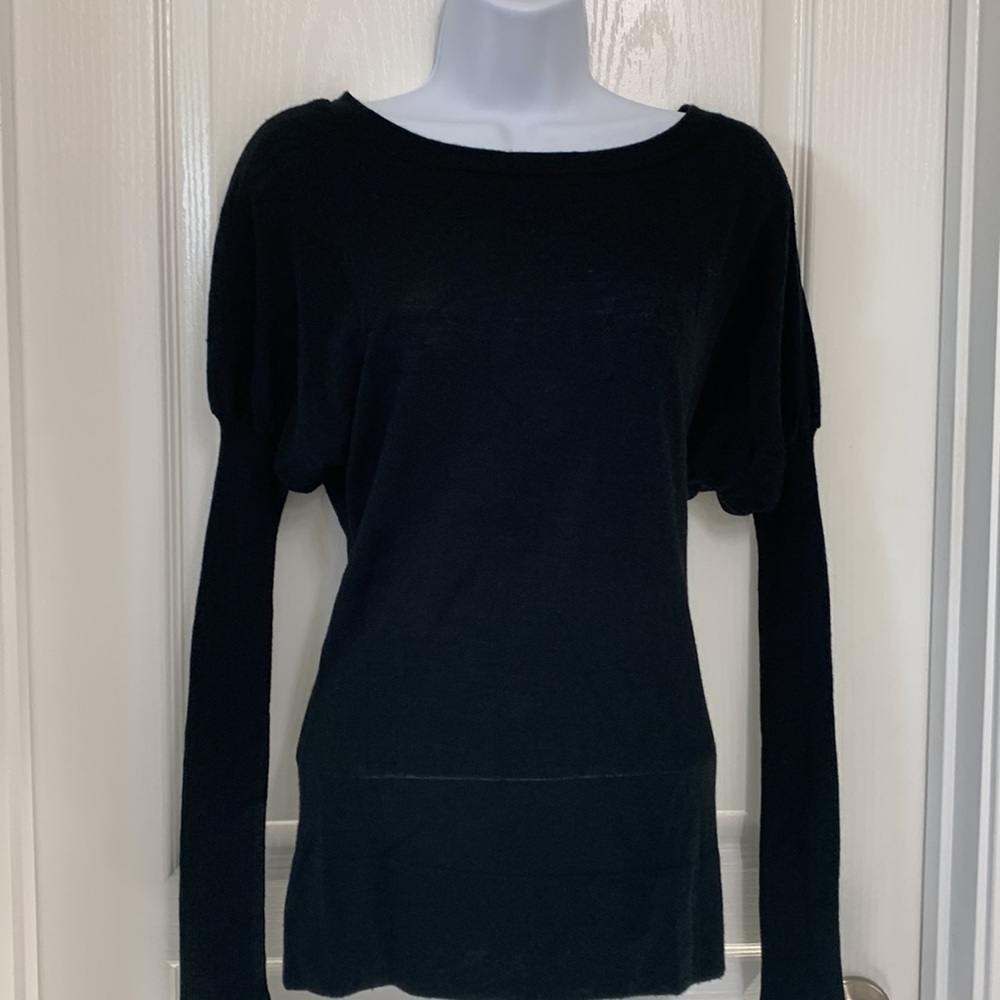 Lightweight black scoop neck sweater with tight forearms.